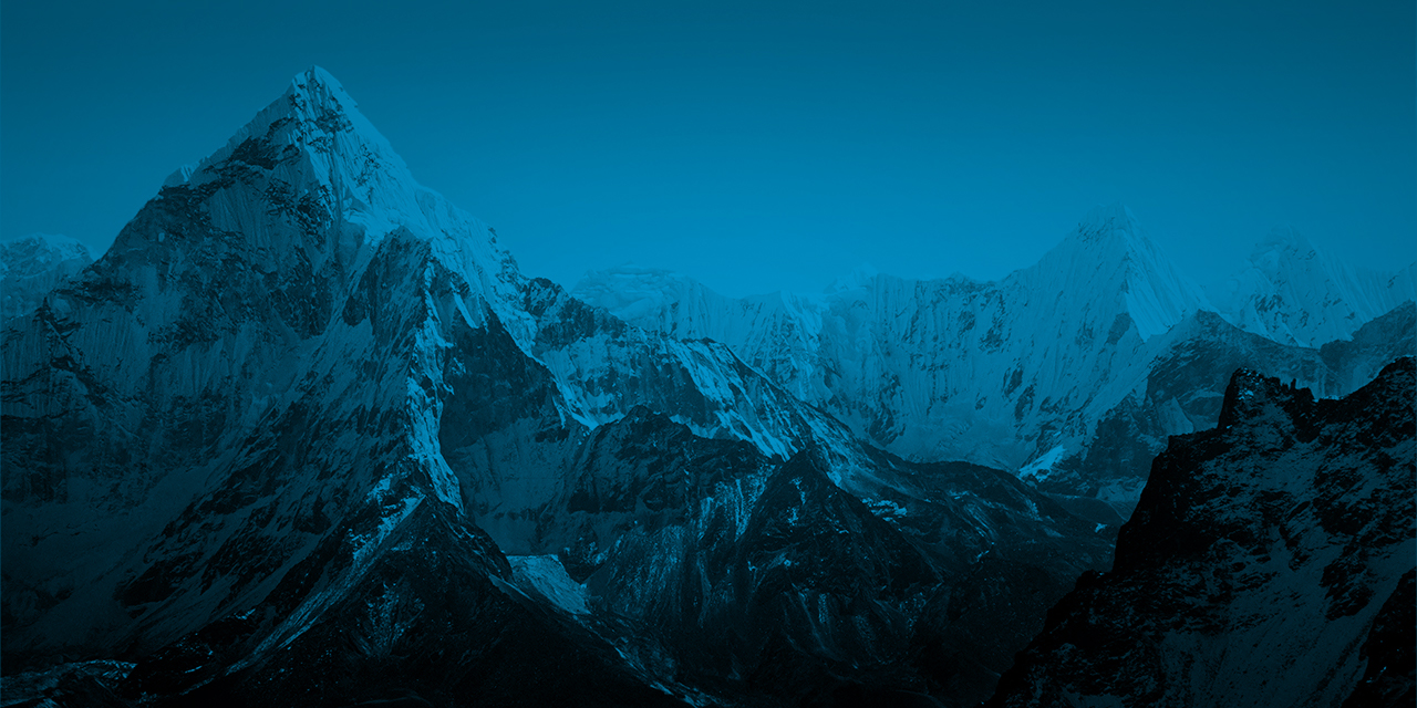 Styled photo of a mountain landscape overlaid with a translucent blue color